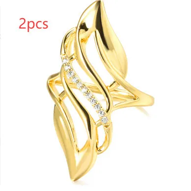 Gold-coloured copper women's ring with exaggerated curve design on finger
