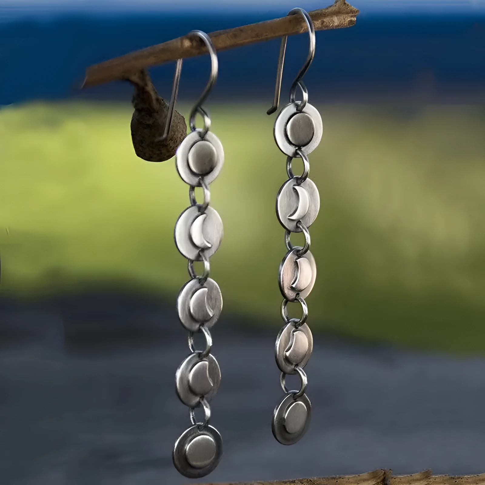 Geometric disc handmade moon long earrings in silver colour on alloy base, drop dangle style for women