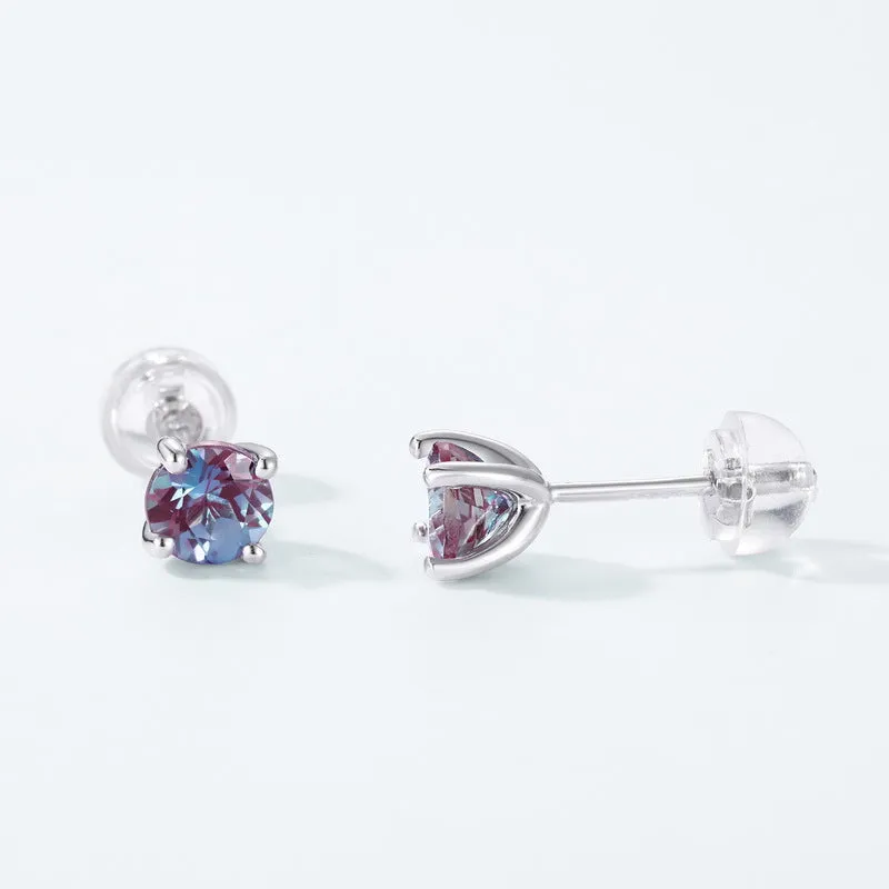 A pair of geometric 925 silver ear studs featuring a cultivated Alexandrite stone.