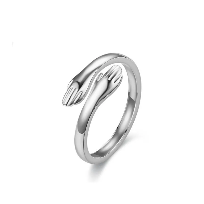 Geometric titanium steel ring with stamping finish in silver colour on a neutral background
