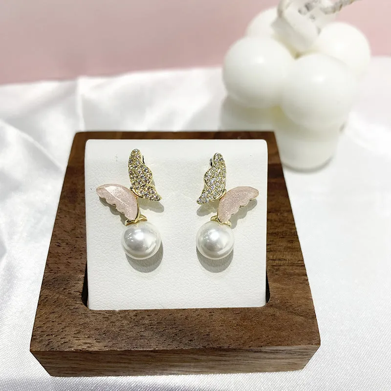 Pearl Zircon Bow Temperament Light Luxury Niche Earrings in pink colour, dangle style