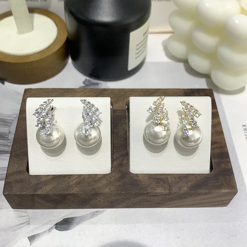 Curved zircon pearl earrings available in golden cats eye stone, golden white pearl, and silver white pearl