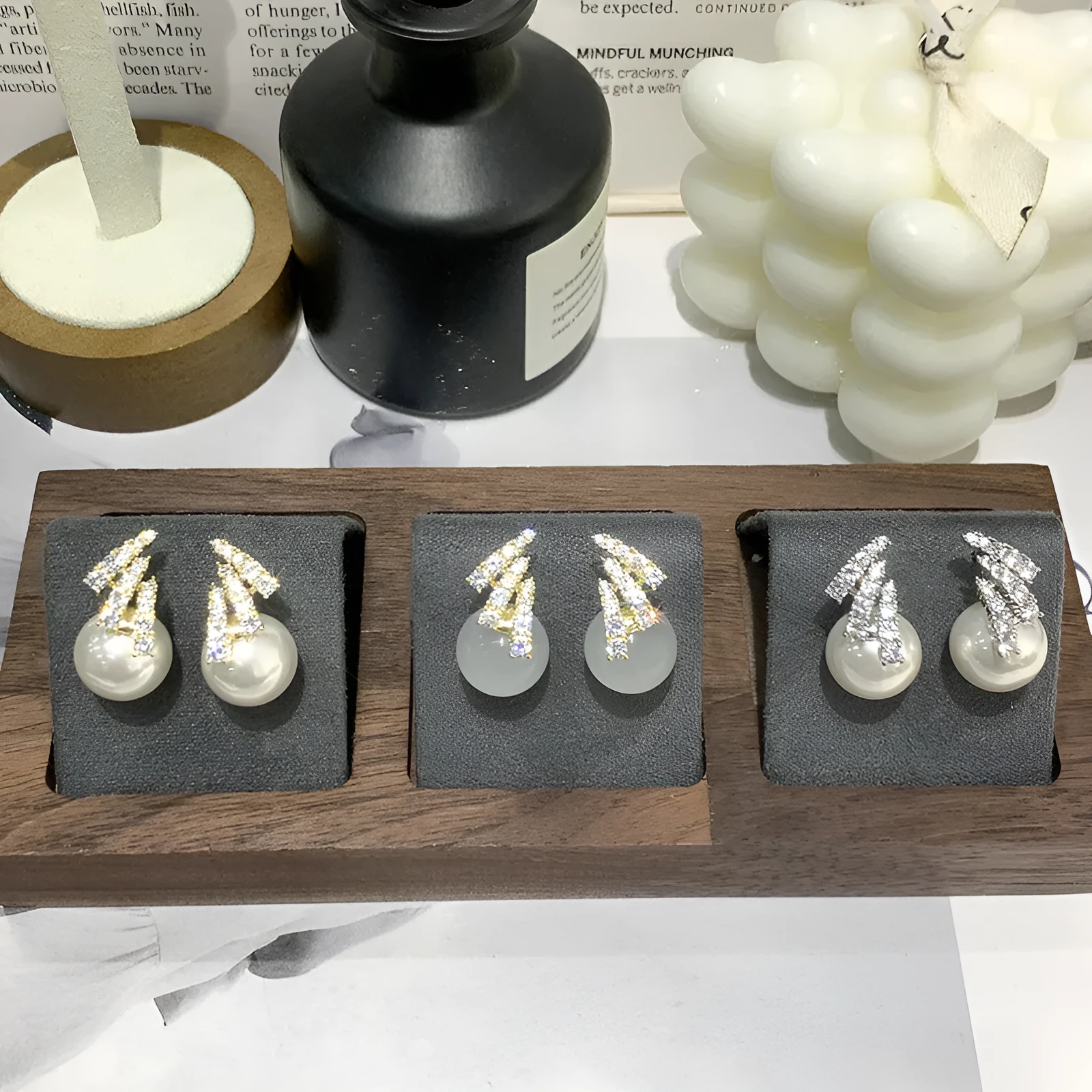 Curved zircon pearl earrings available in golden cats eye stone, golden white pearl, and silver white pearl