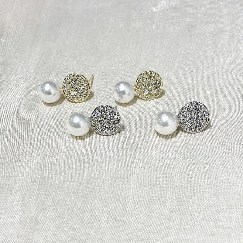 Round diamond studded pearl earrings in gold finish with post back closure