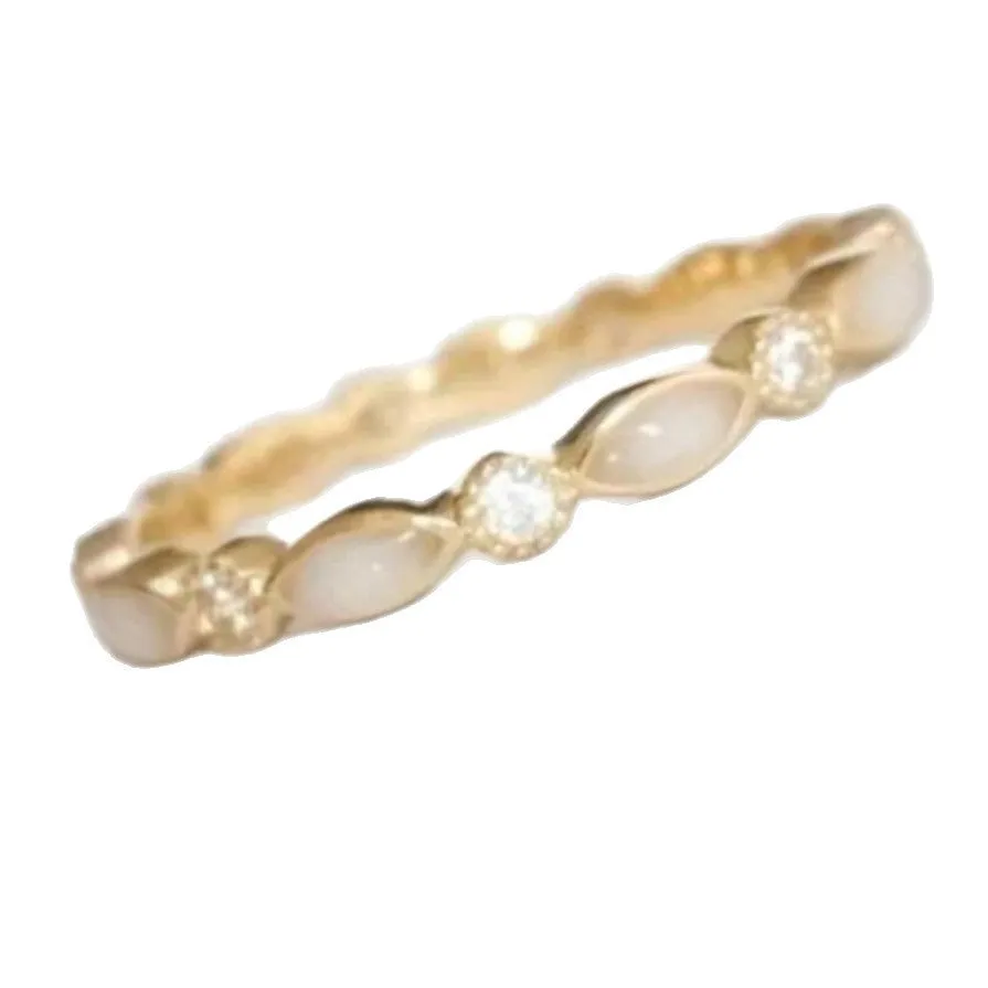 French golden opal open adjustable ring in gold alloy with geometric shape on a white background