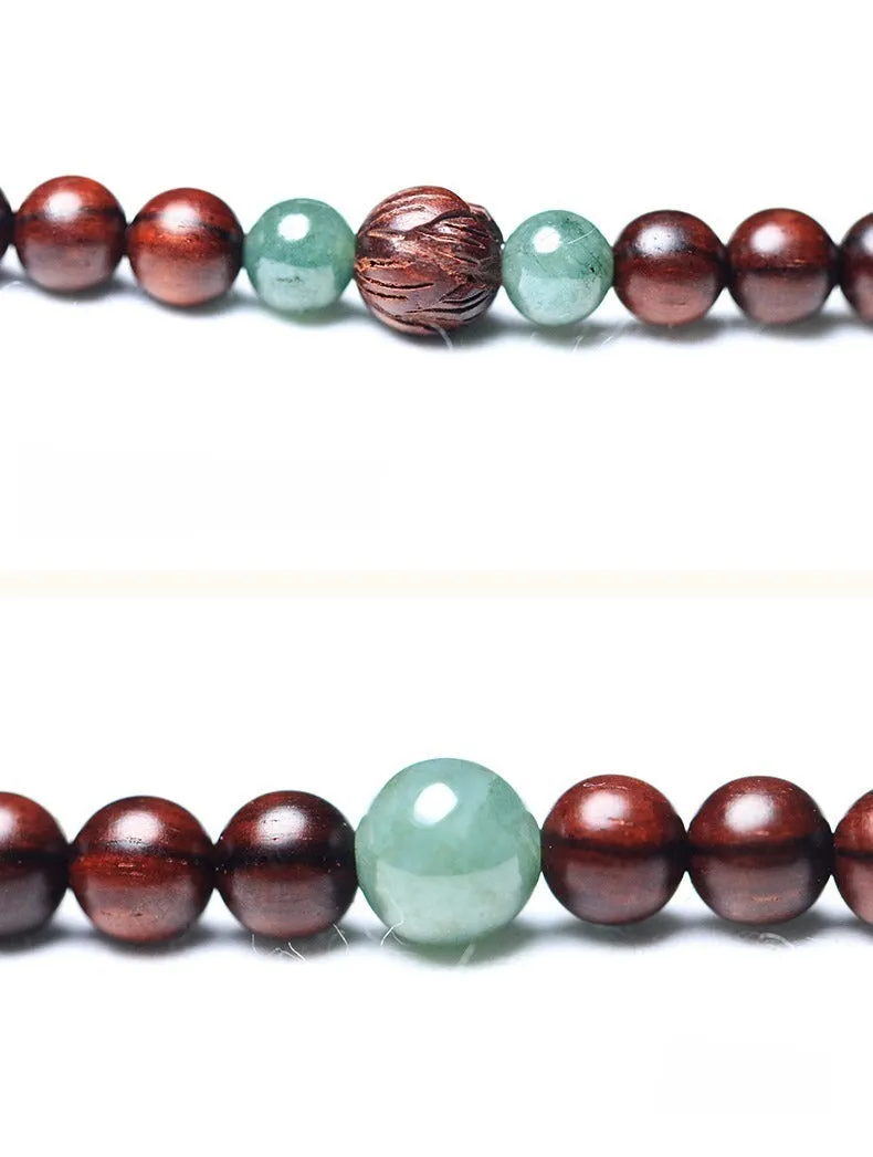 Rosewood bead bracelet with 108 beads and a carved green Hotian jade pendant.