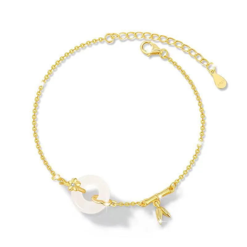 Gold tone women's bracelet with white chalcedony stone and adjustable peace symbol buckle closure