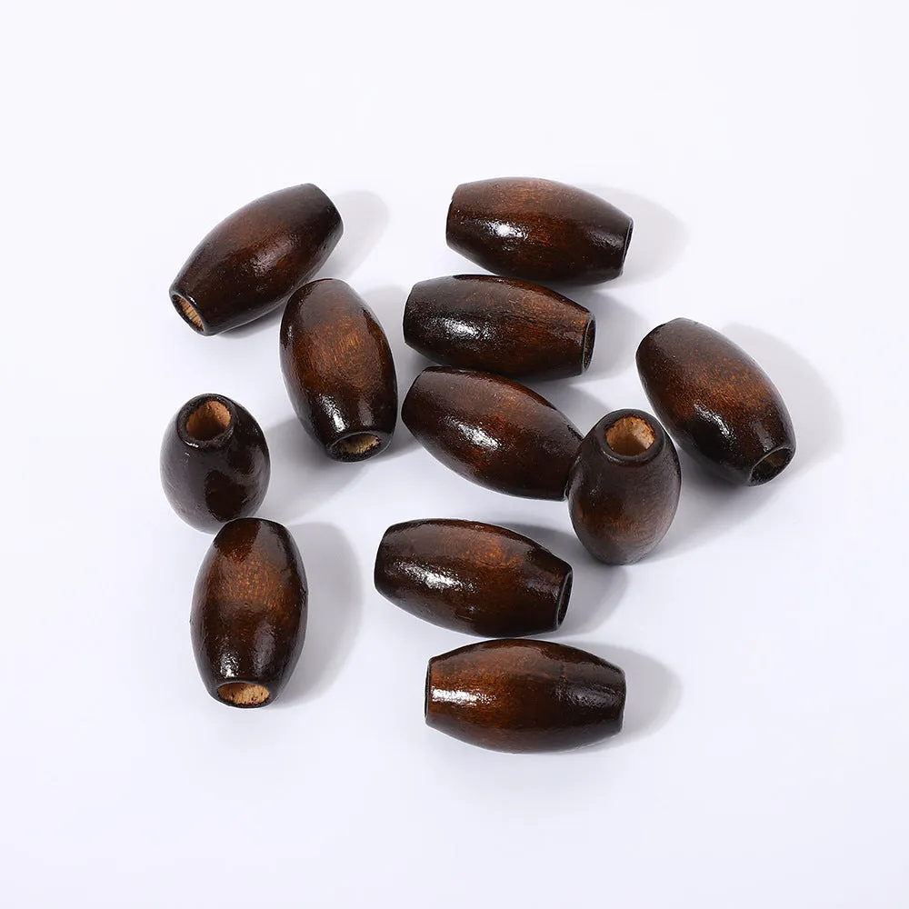 Dark coffee coloured wooden oval bead with M-shaped raised design, 25mm size