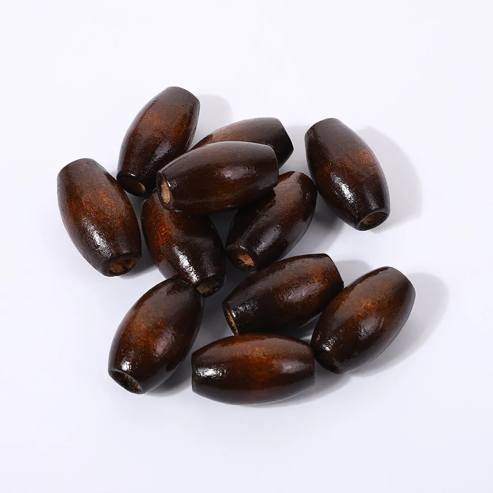 Dark coffee coloured wooden oval bead with M-shaped raised design, 25mm size