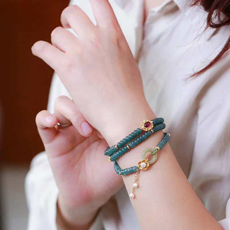 Blue water jade abacus bead and tourmaline bracelet on three sterling silver rings for women.