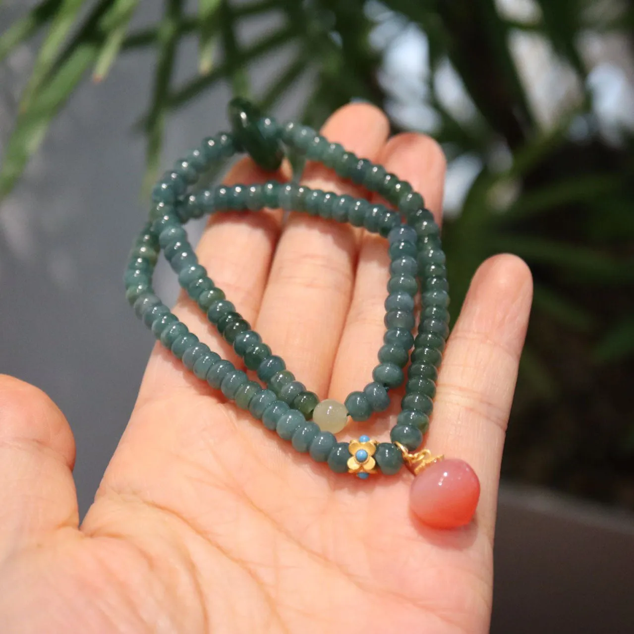Blue water jade abacus bead and tourmaline bracelet on three sterling silver rings for women.