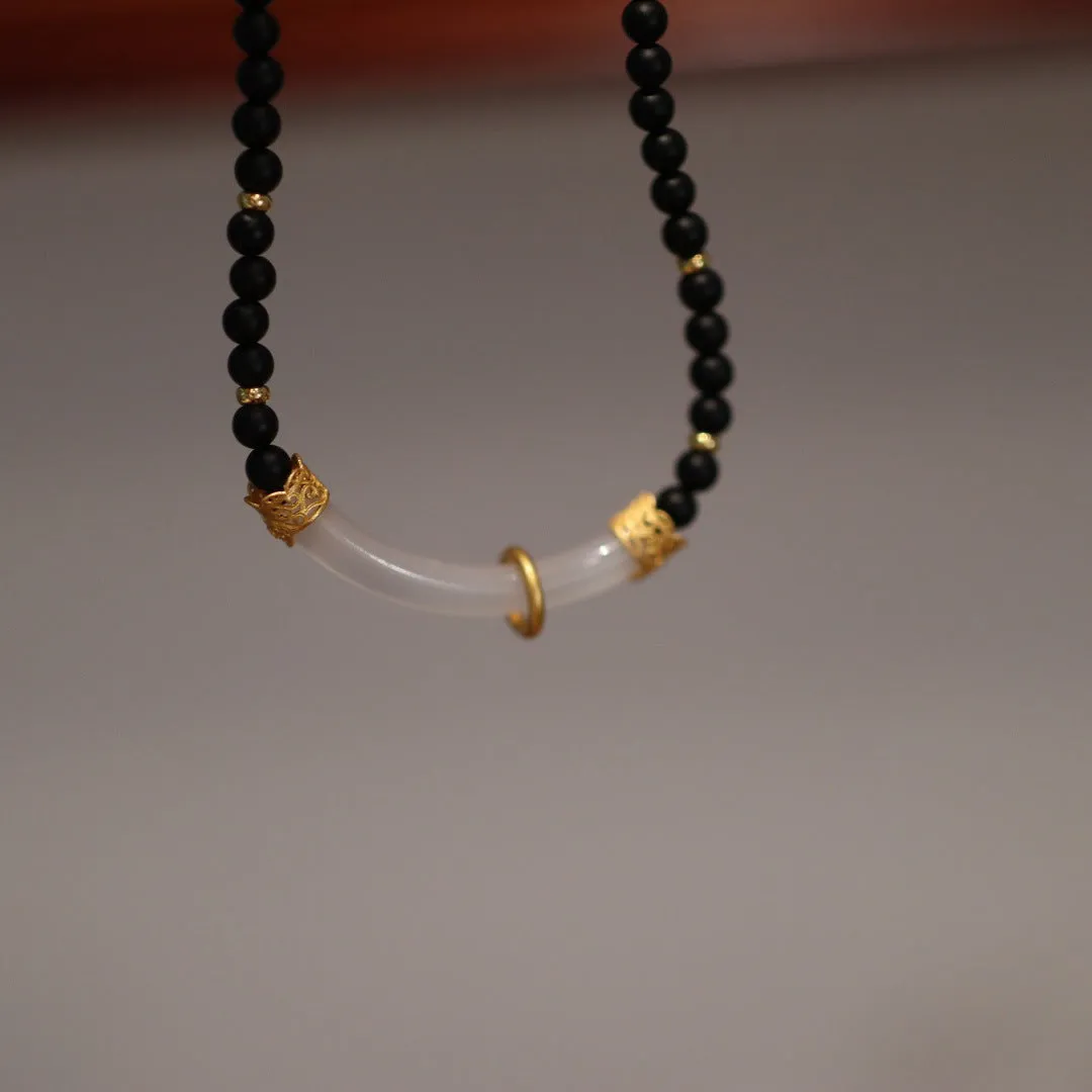 Frosted black agate pendant necklace with white chalcedony detailing on 925 silver chain