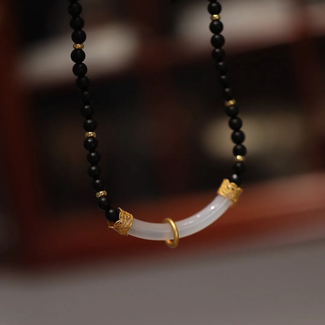 Frosted black agate pendant necklace with white chalcedony detailing on 925 silver chain