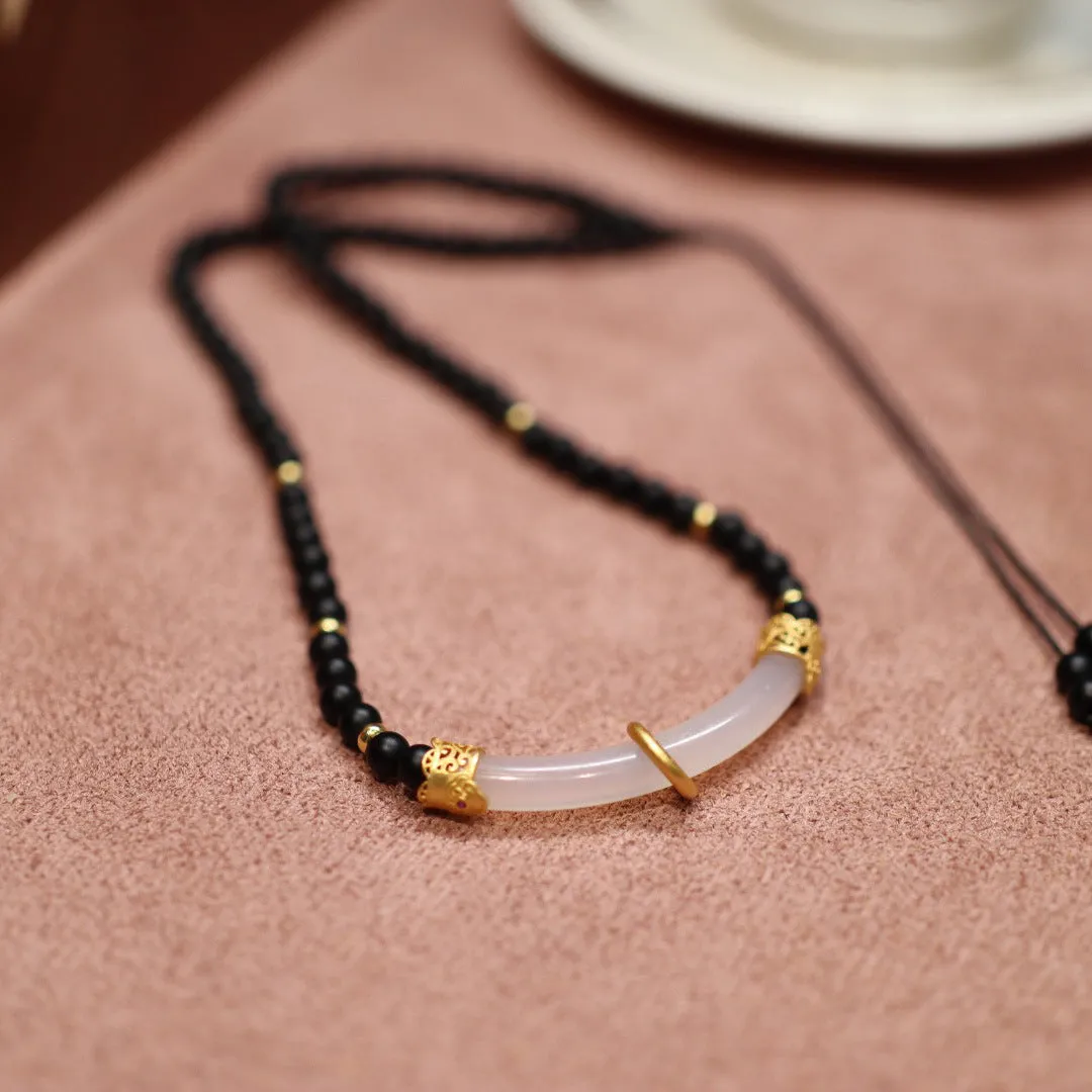 Frosted black agate pendant necklace with white chalcedony detailing on 925 silver chain