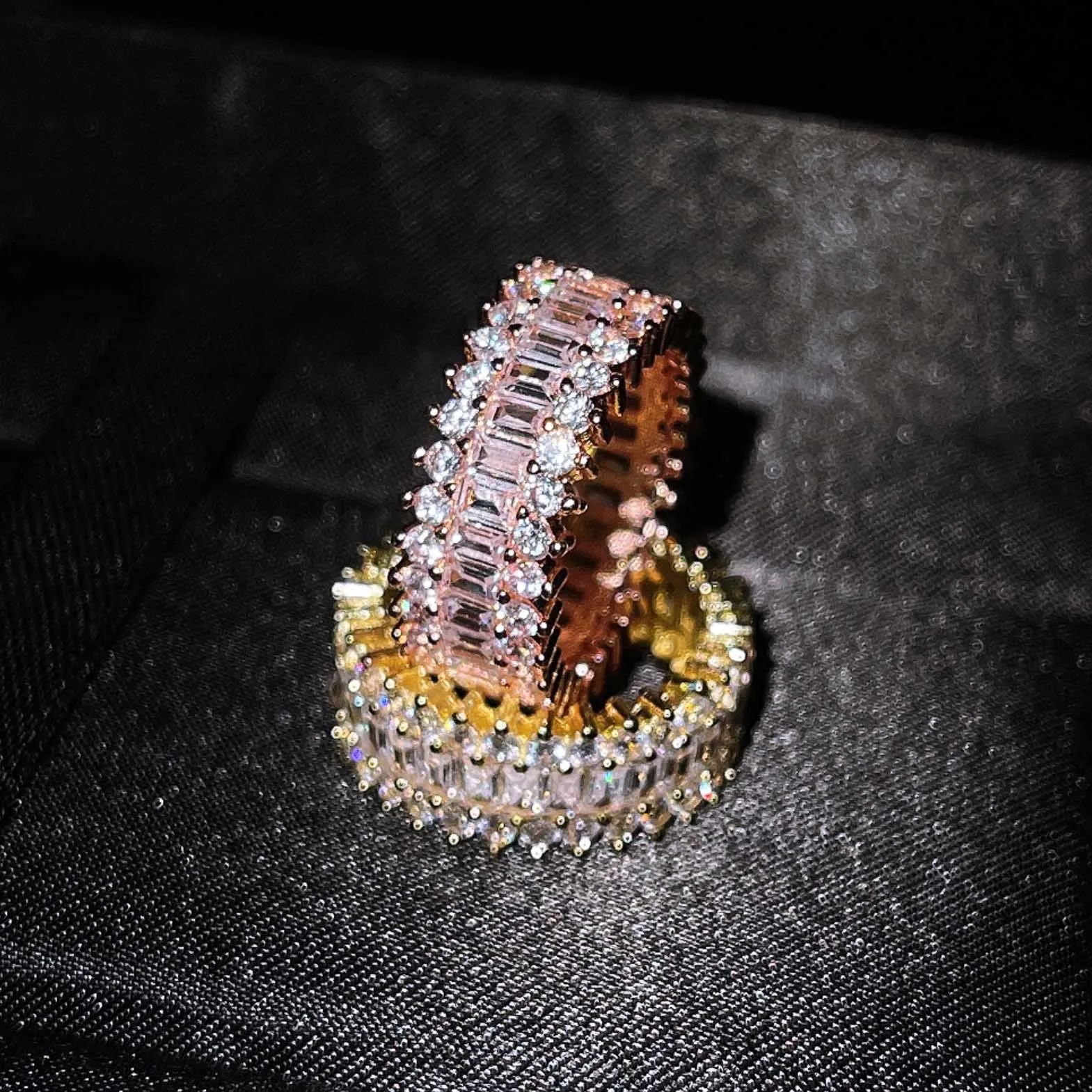 Geometric copper ring with zircon inlay in rose gold finish on neutral background