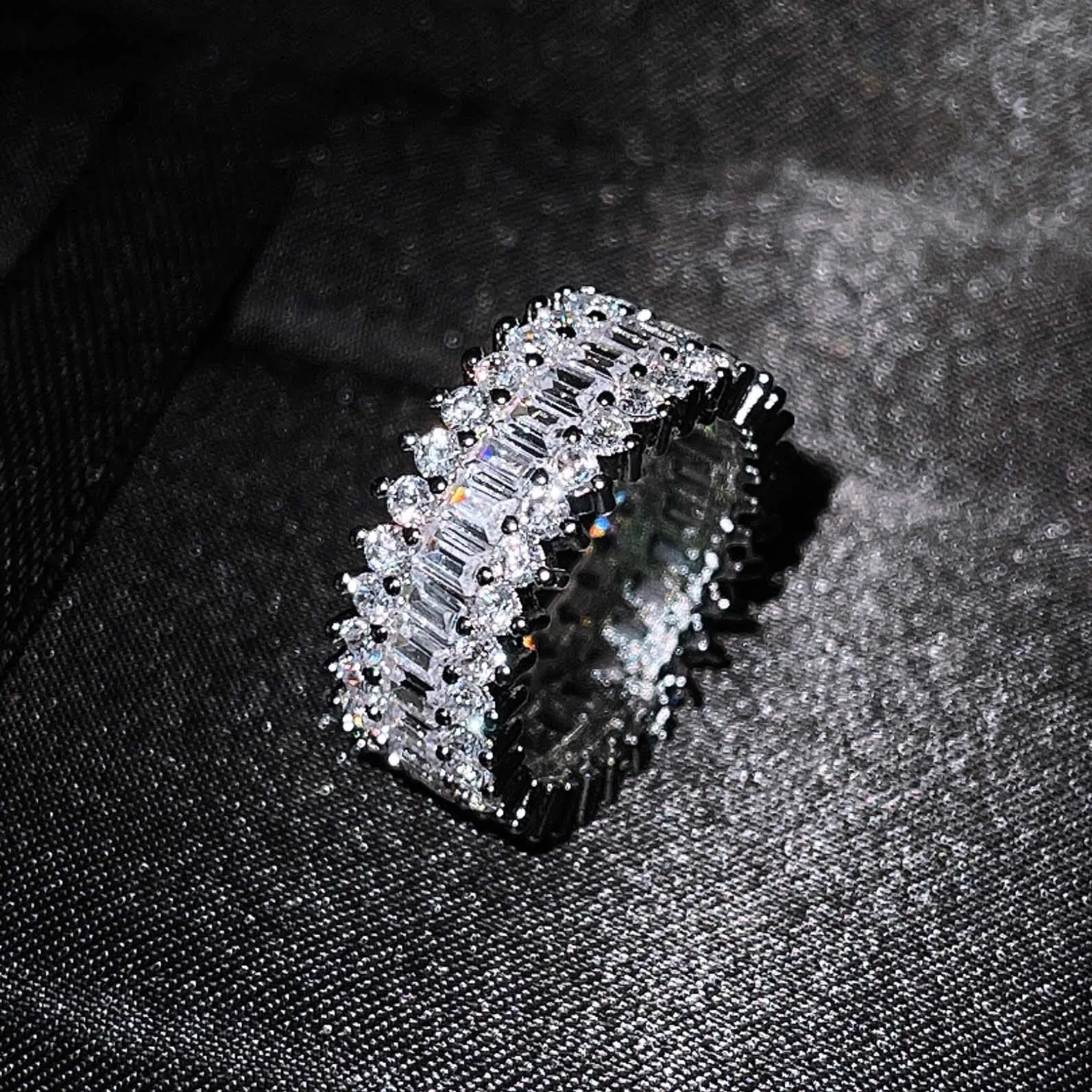 Geometric copper ring with zircon inlay in rose gold finish on neutral background