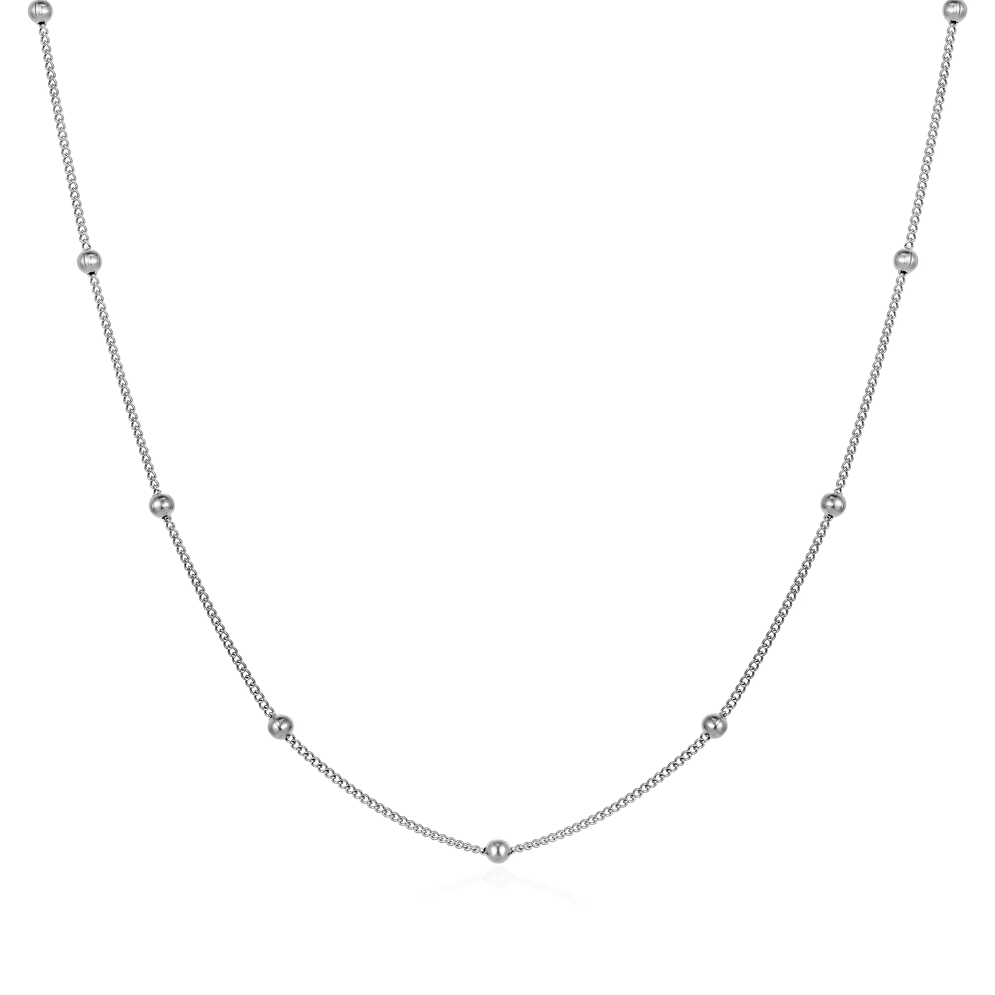 Women's stainless steel necklace with 18K gold hollow round pendant and O-link chain on neutral background
