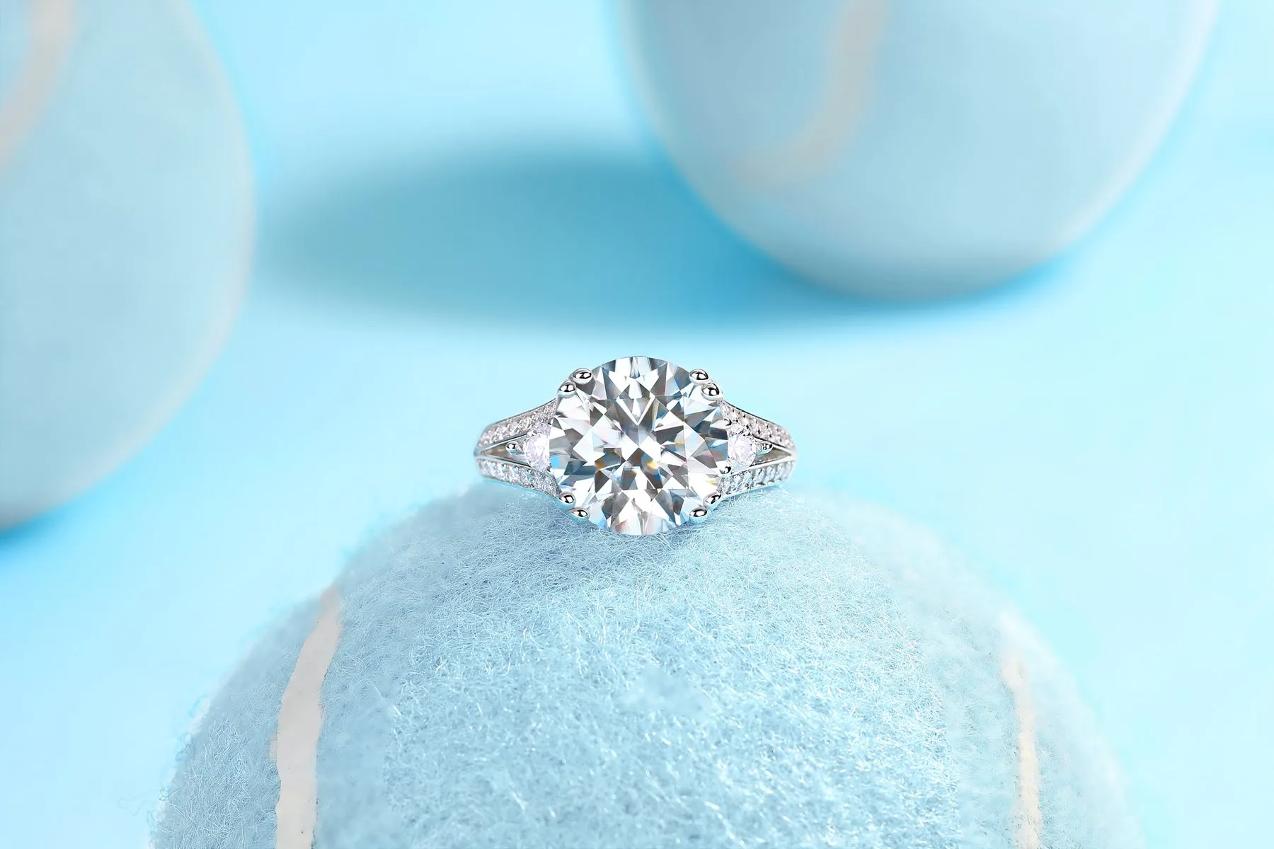 5-carat moissanite wedding ring in S925 silver with gold plating on white background