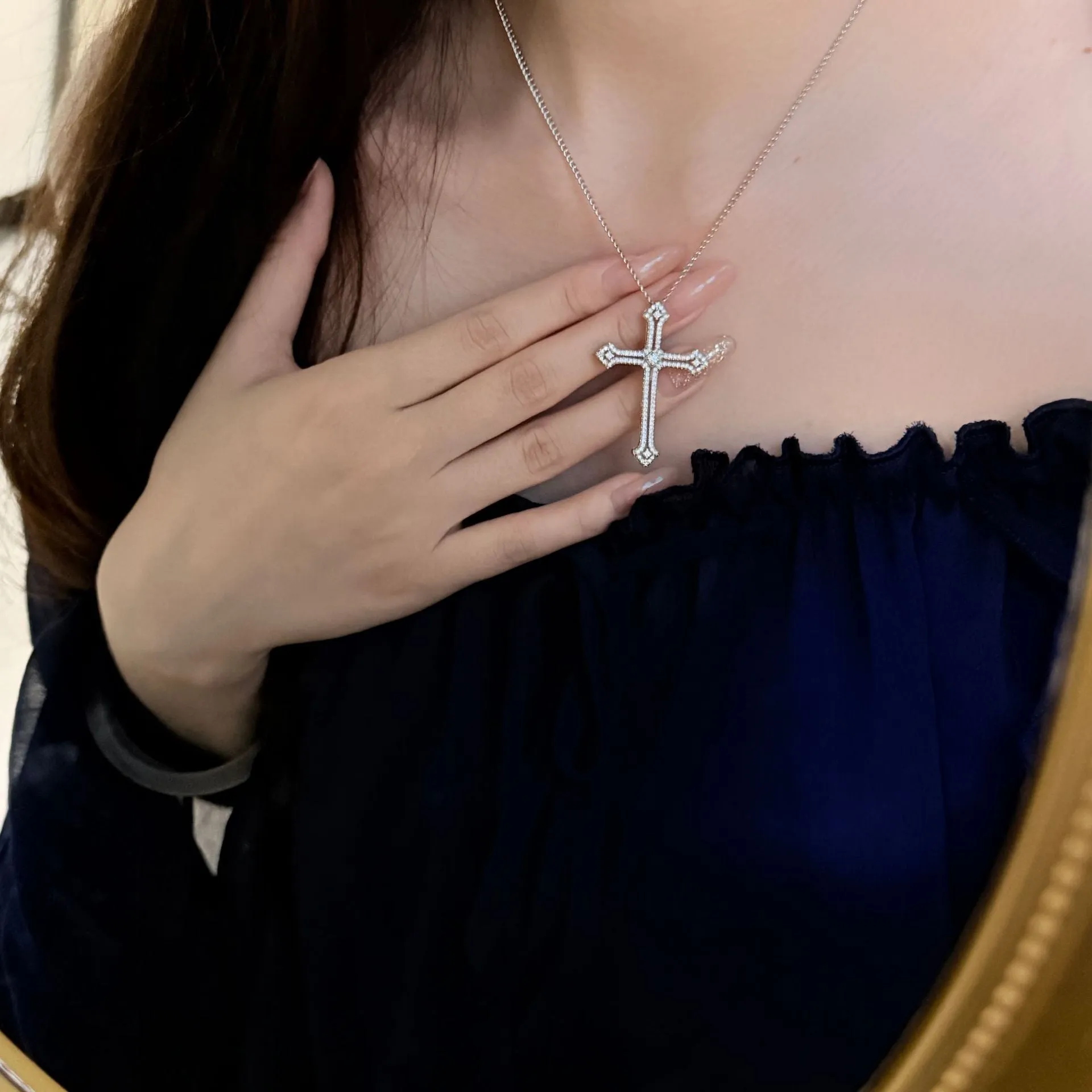 Copper geometric cross necklace with electroplated finish on women's neck
