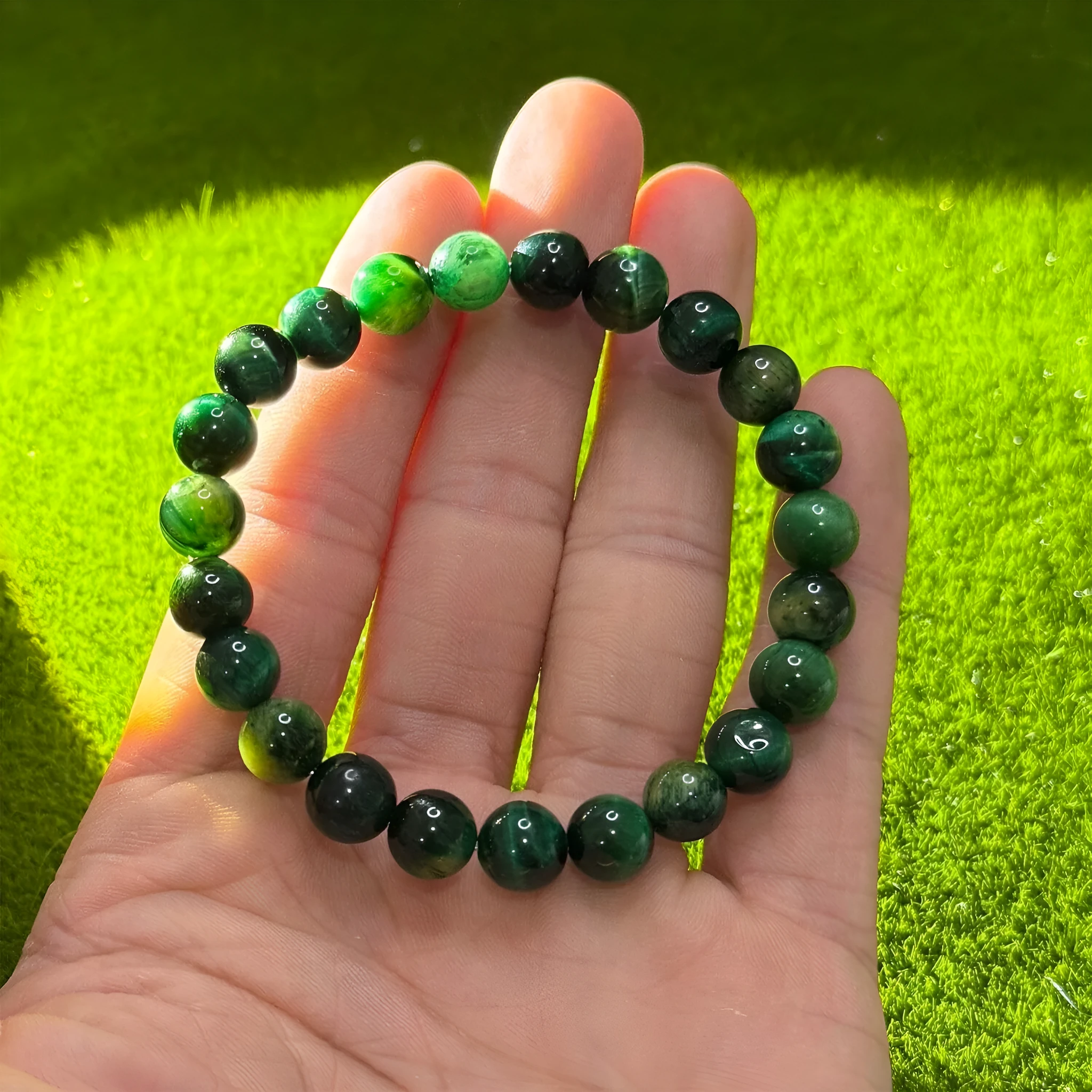 Handmade green opal glass beaded bracelet on a white background