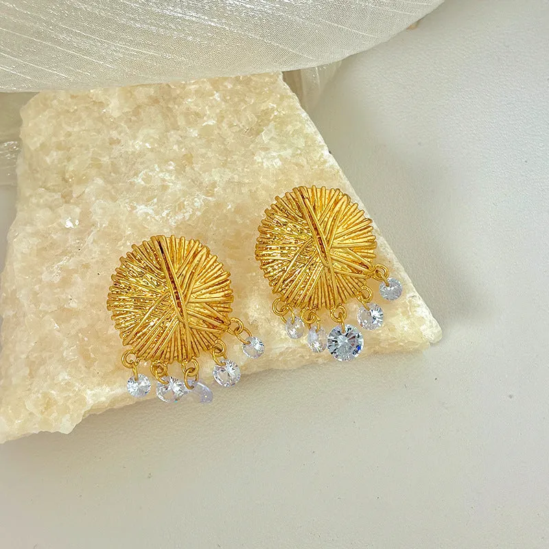 Women's gold geometric hoop earrings with round elements and electroplated finish