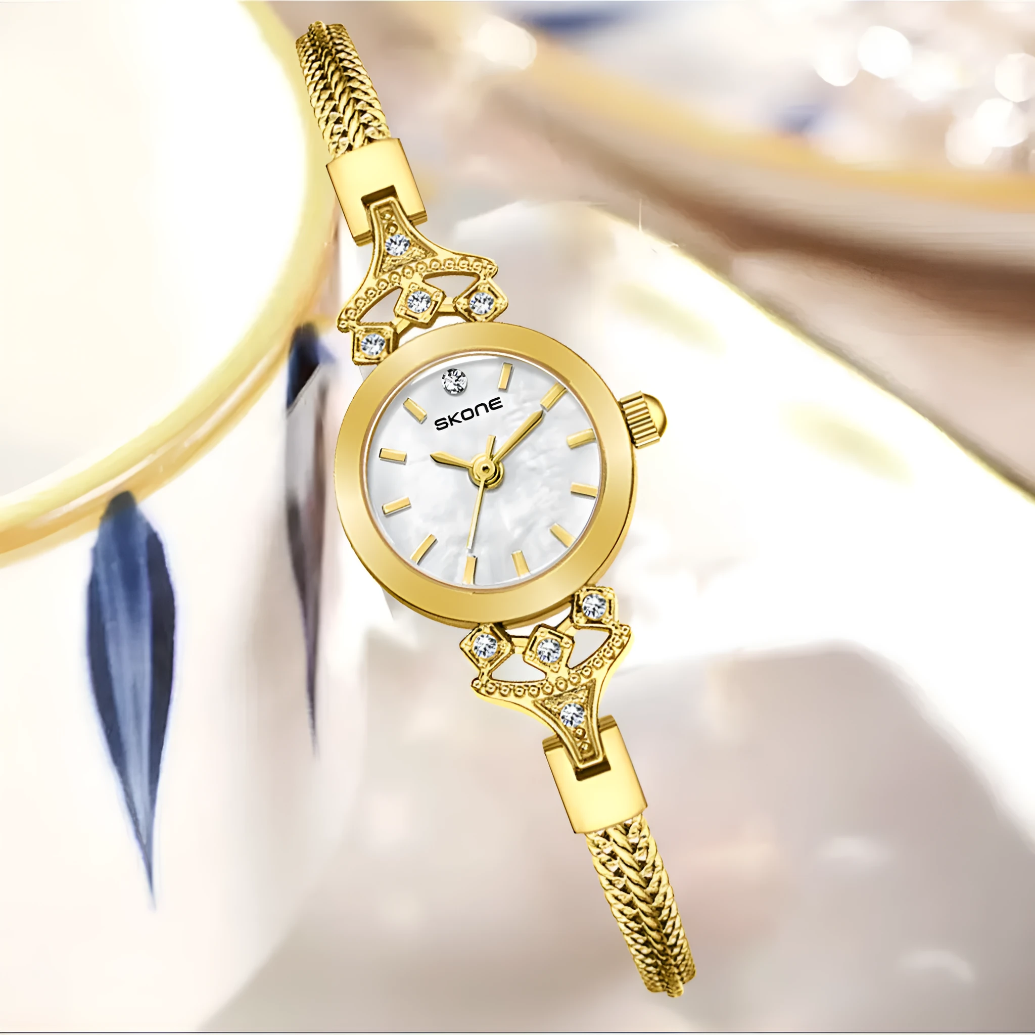 Women's quartz watch with gold white face and slim 8mm profile.