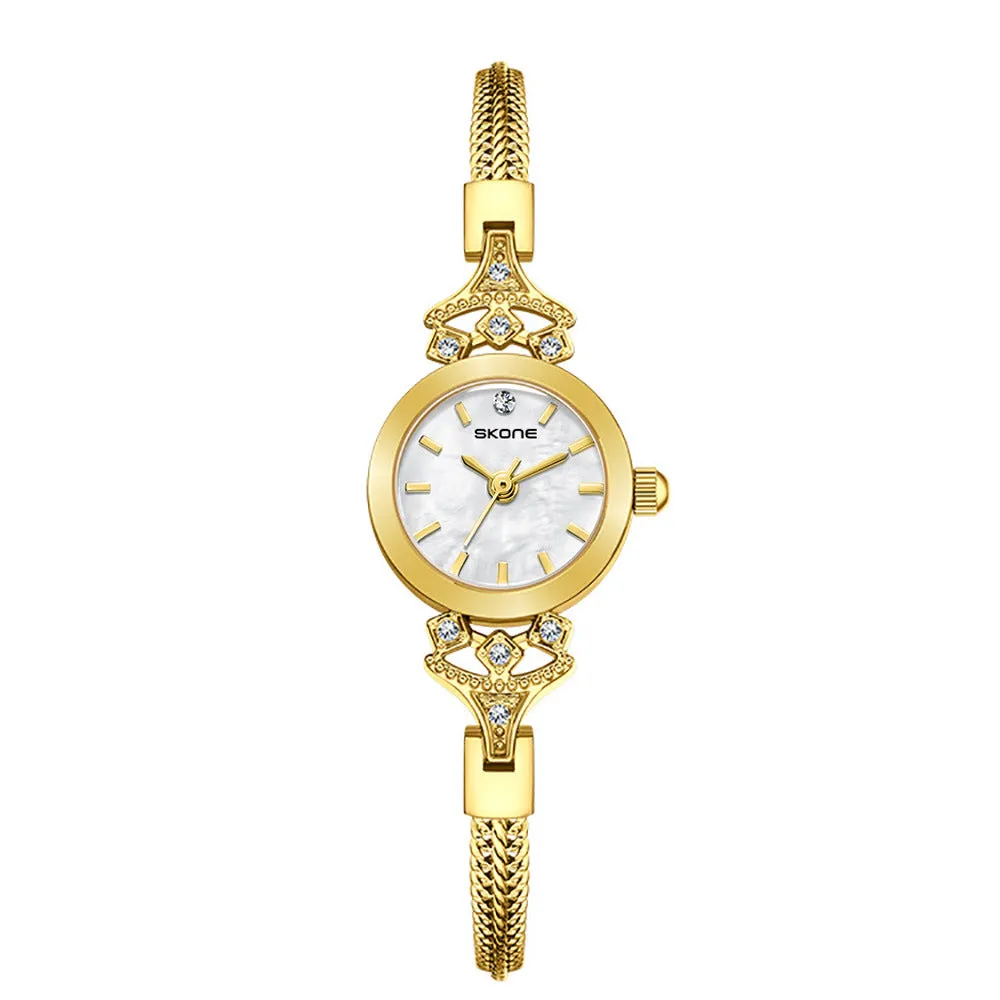 Women's quartz watch with gold white face and slim 8mm profile.