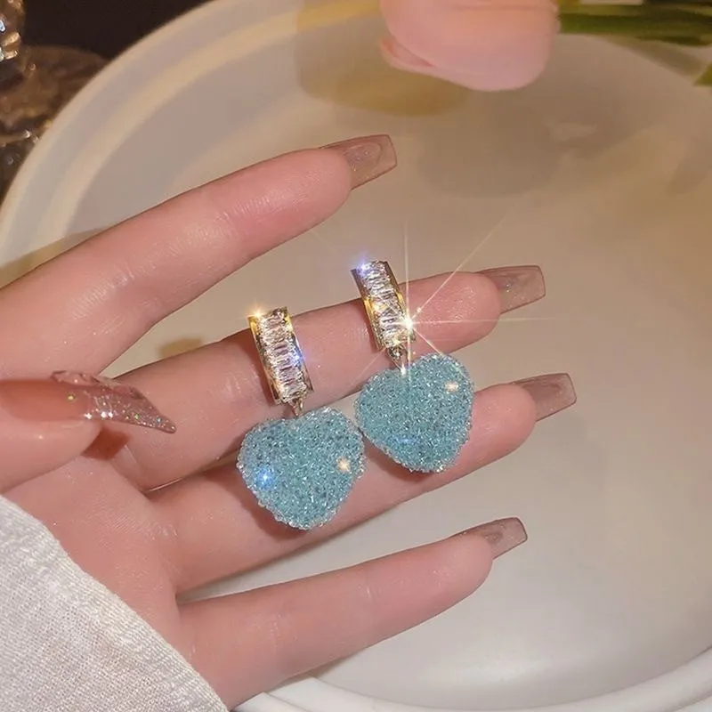 Peach heart-shaped stud earrings with candy gemstone accents in pink and blue colour variations