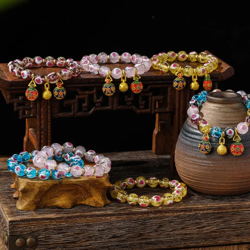 Handmade heart-shaped glass bead bracelet with ancient fluorescent glaze and swallowing gold beast design