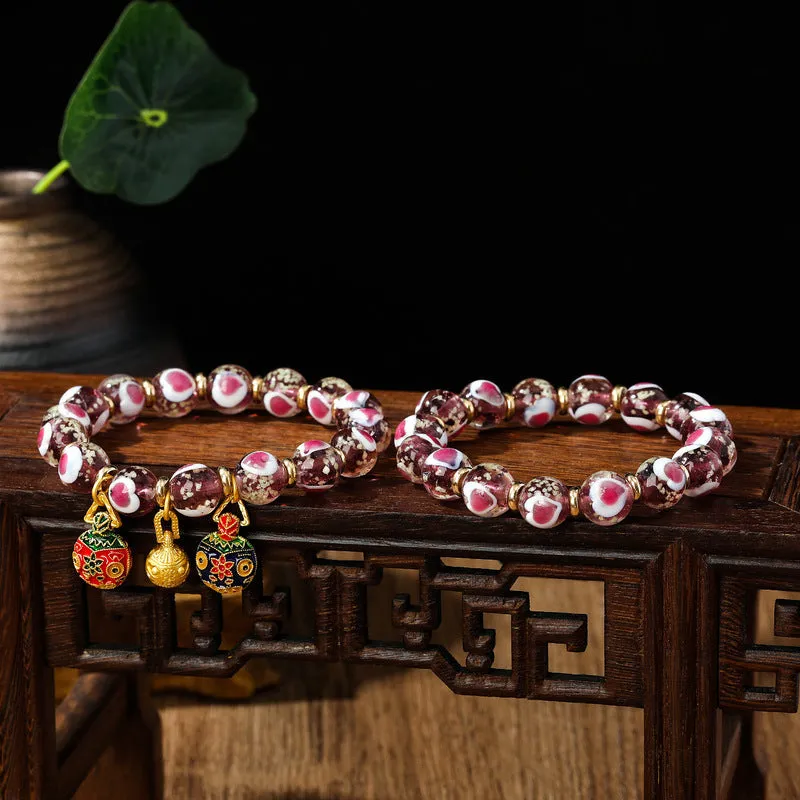 Handmade heart-shaped glass bead bracelet with ancient fluorescent glaze and swallowing gold beast design