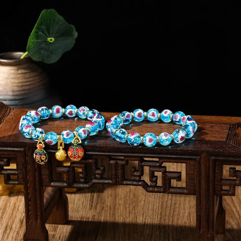 Handmade heart-shaped glass bead bracelet with ancient fluorescent glaze and swallowing gold beast design