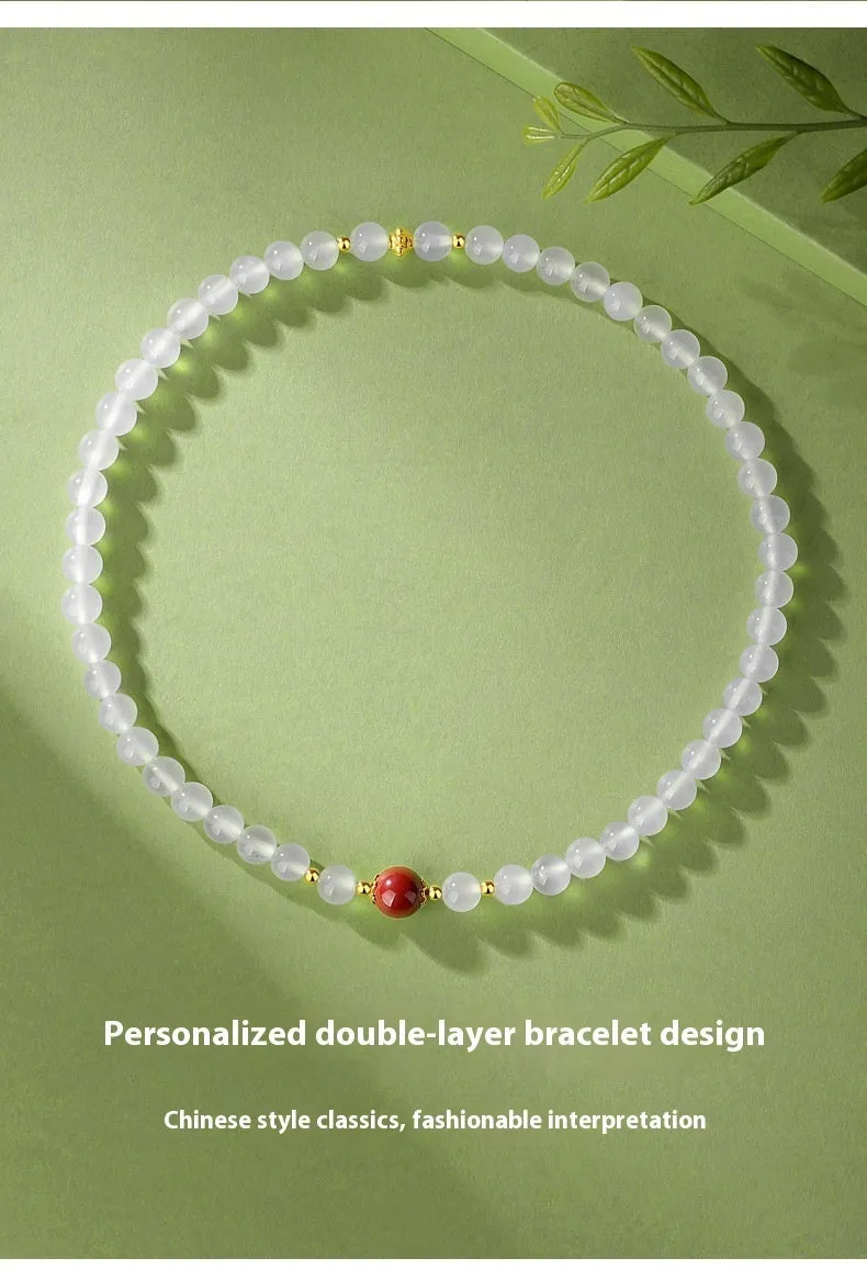 White agate women's bracelet with geometric design and Jequirity Bean Cinnabar detailing