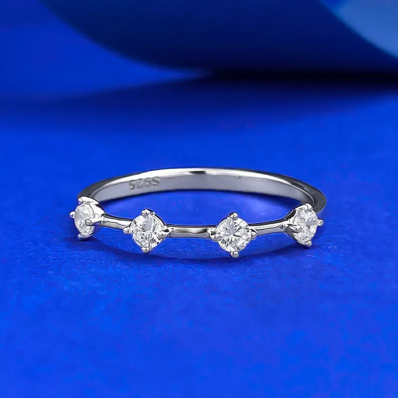 Gold electroplated minimalist ring with a row of small diamonds on silver band