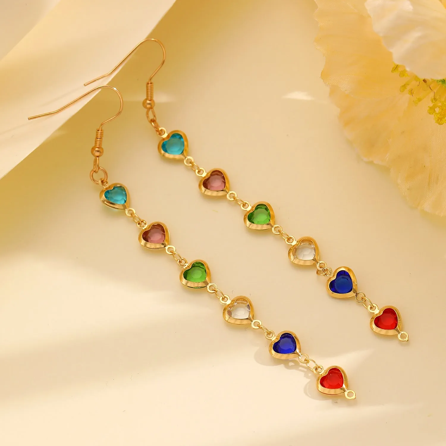 Women's colourful water drop tassel earrings in gold-tone electroplated copper on a plain background