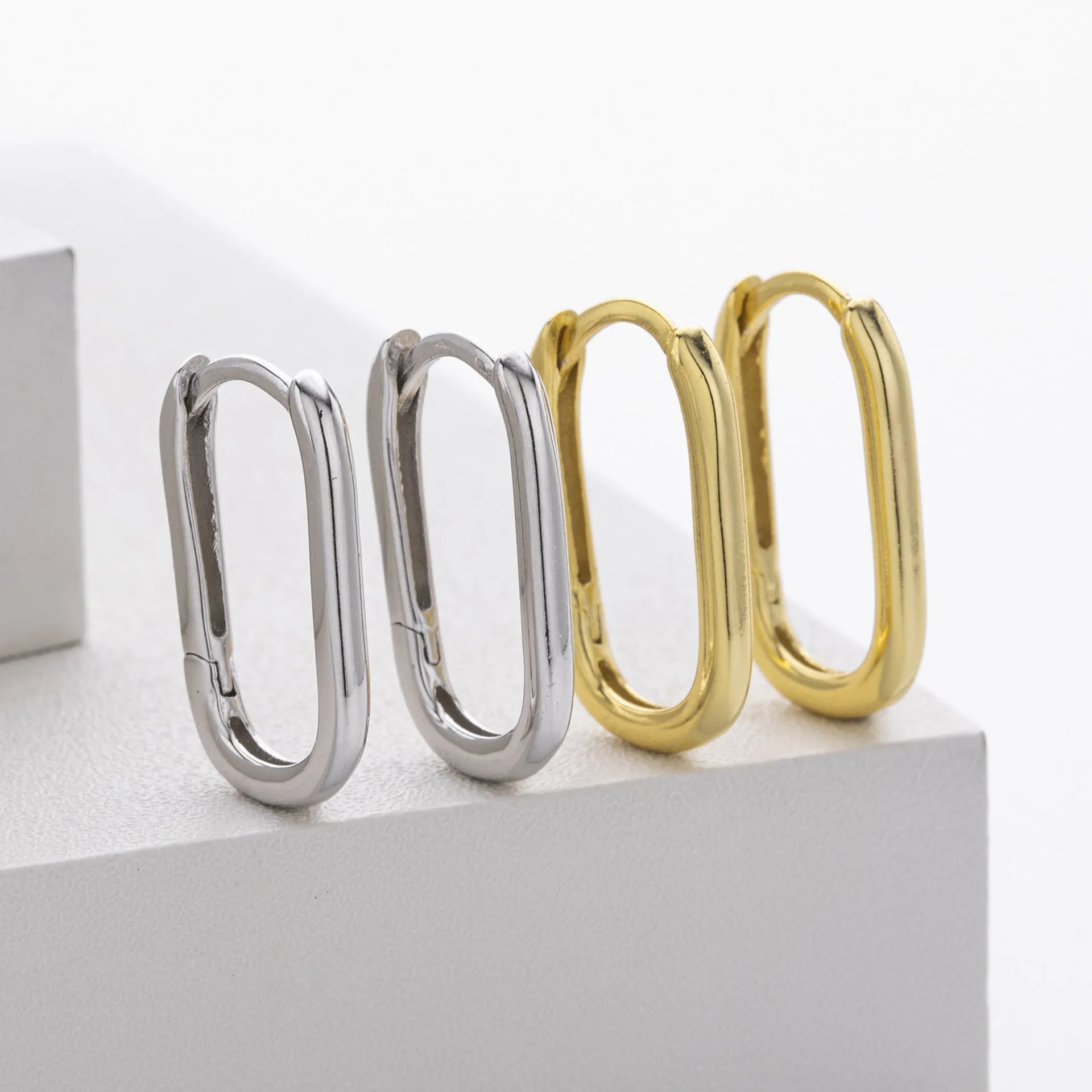 925 silver geometric earrings with gold plating oval quadrilateral shape on white background
