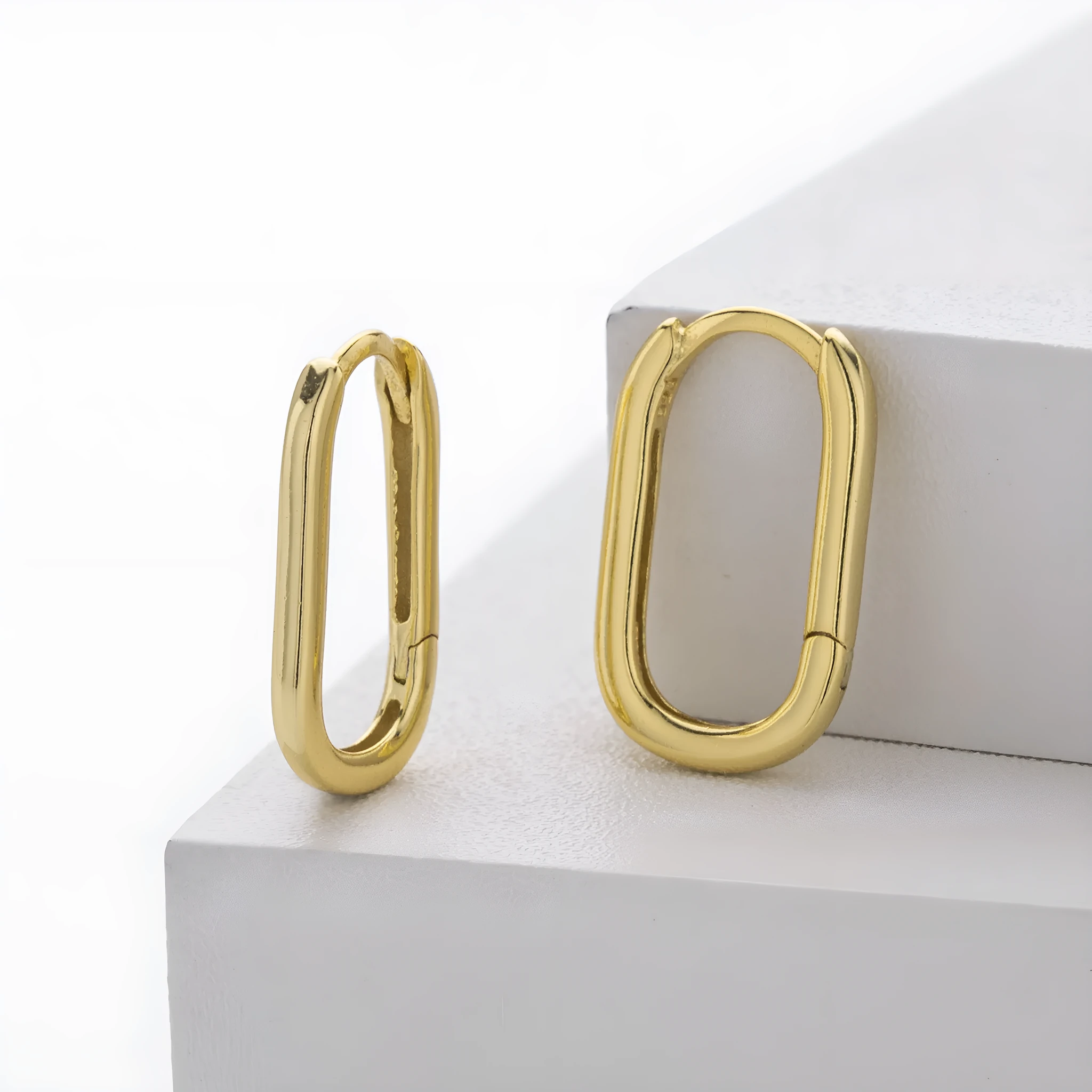 925 silver geometric earrings with gold plating oval quadrilateral shape on white background