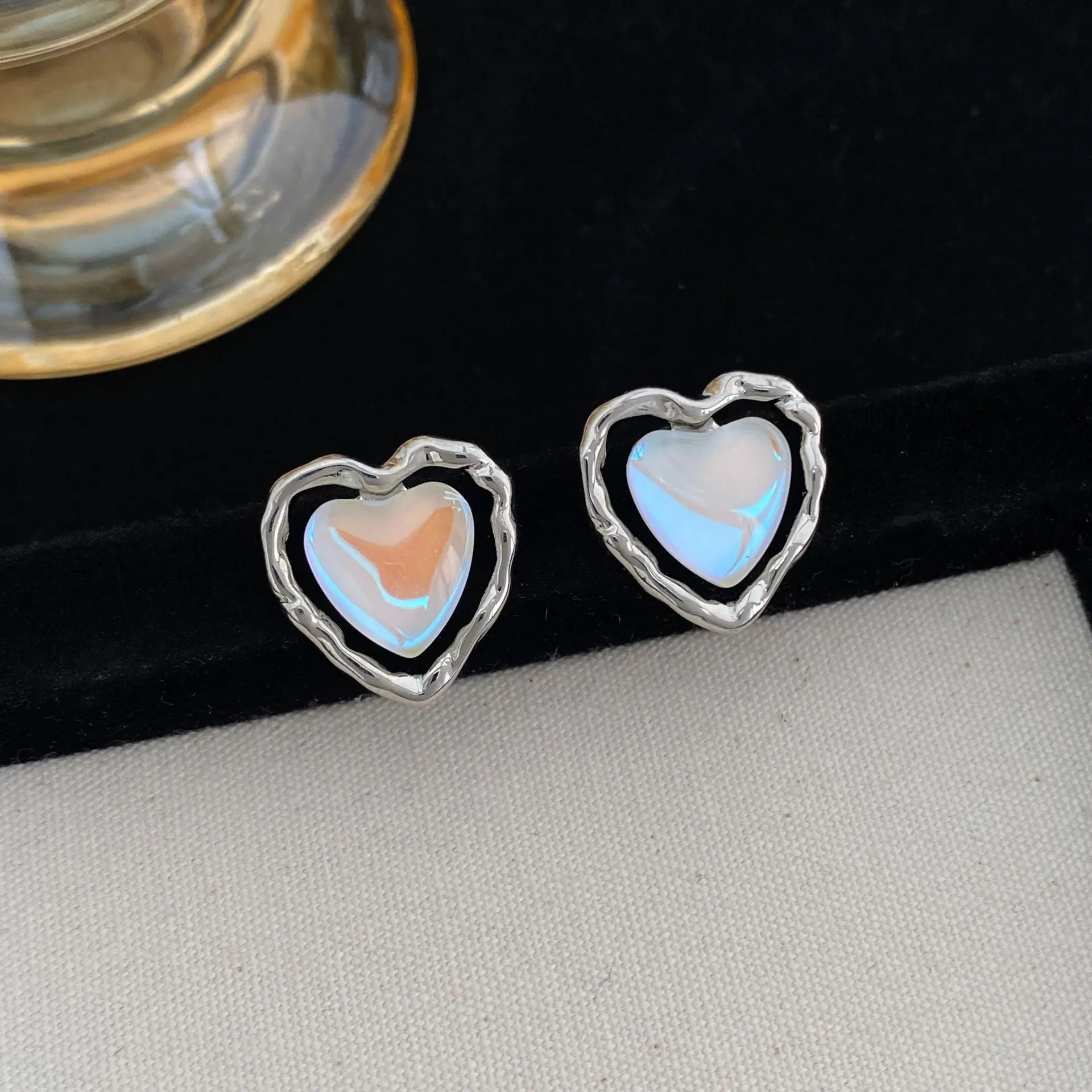 Women's alloy geometric heart earrings in ear clip and ear stud styles with electroplated finish
