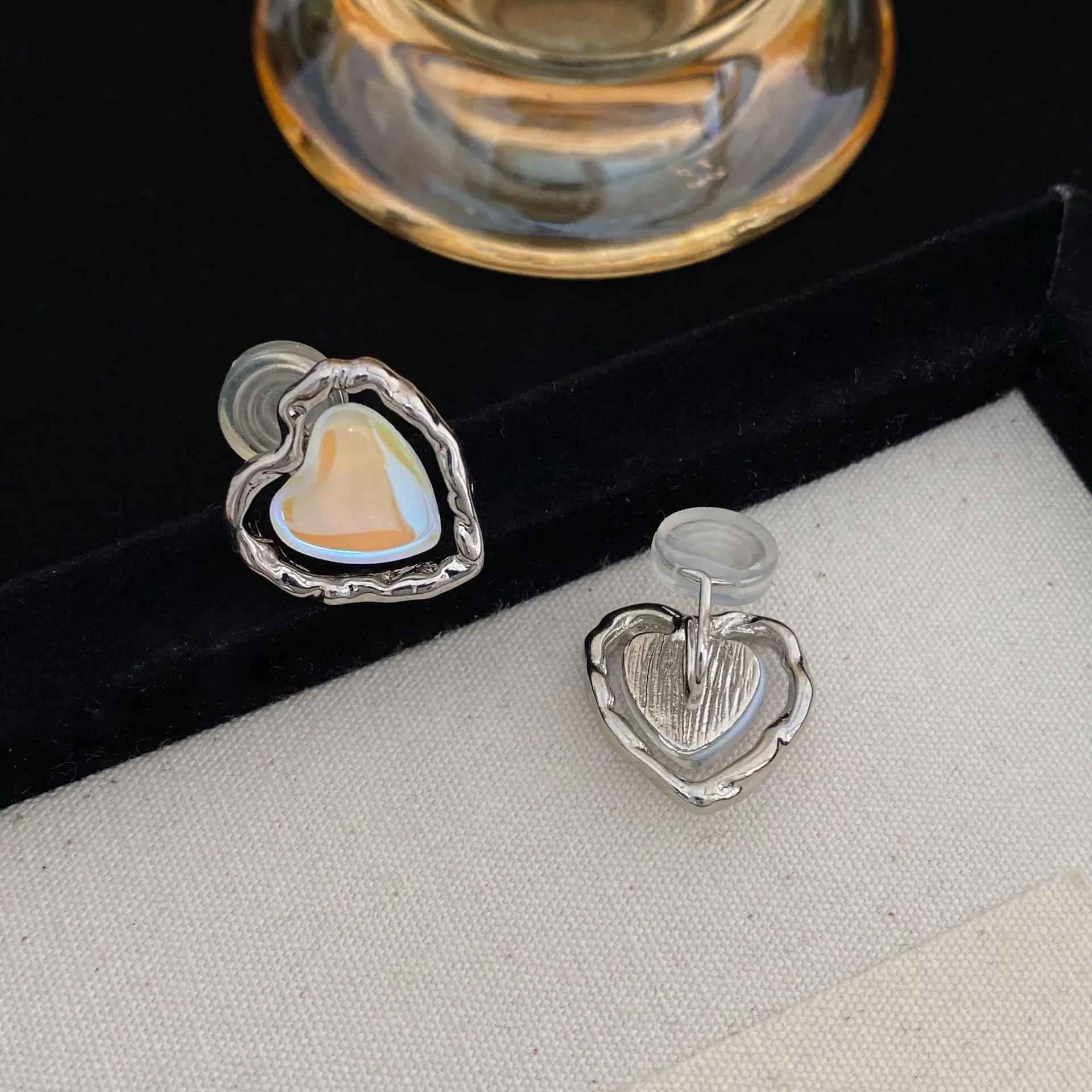 Women's alloy geometric heart earrings in ear clip and ear stud styles with electroplated finish
