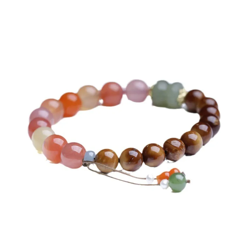 8mm persimmon orange agate bracelet with diamond-shaped beads on wrist
