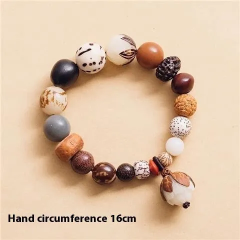 Handmade brown bodhi seed beads bracelet with 18 beads, shown on a wrist.