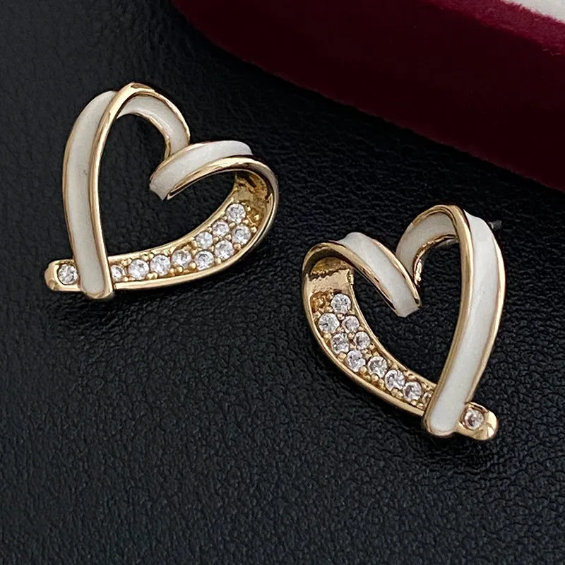 Micro-set zircon asymmetric heart earrings for women, copper base, white colour, ear clip style