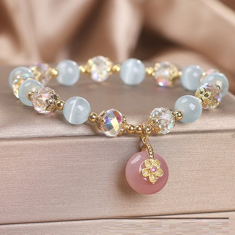 Chinese style sky blue opal peace buckle pendant bracelet for women on a flat surface