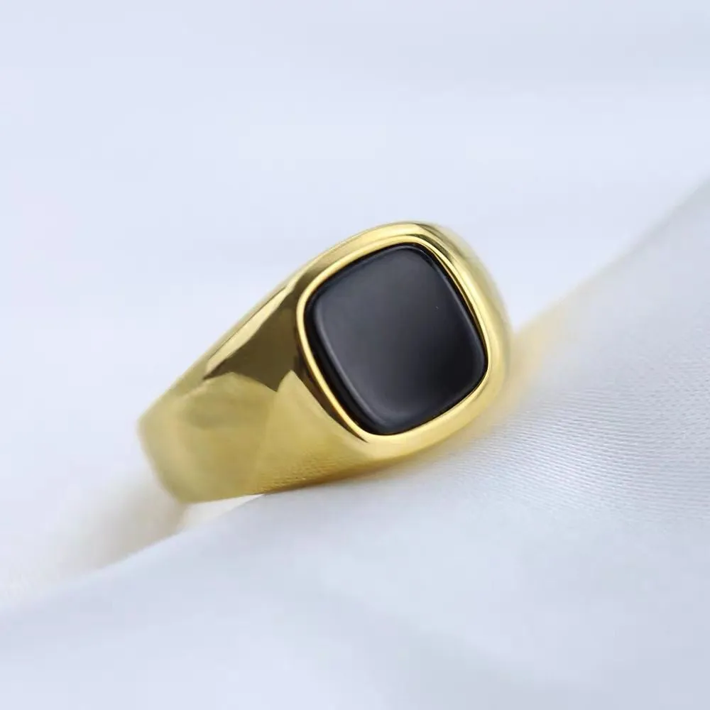Titanium steel hexagonal men's ring with glossy black epoxy inlay on white background