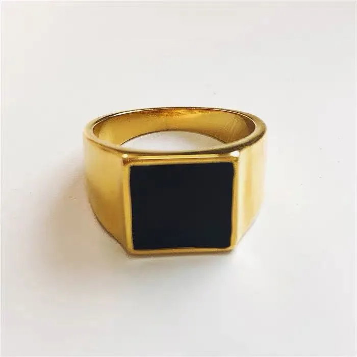 Titanium steel hexagonal men's ring with glossy black epoxy inlay on white background