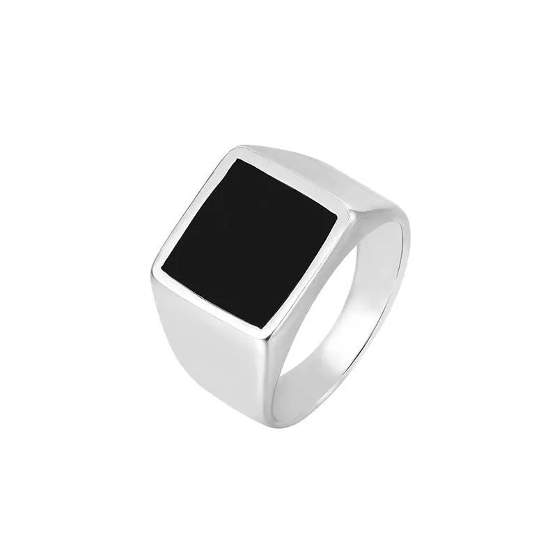 Titanium steel hexagonal men's ring with glossy black epoxy inlay on white background