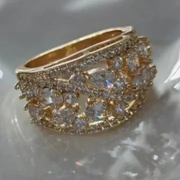 Women's round hollow fashion ring in copper with a choice of gemstone colours on a size chart.