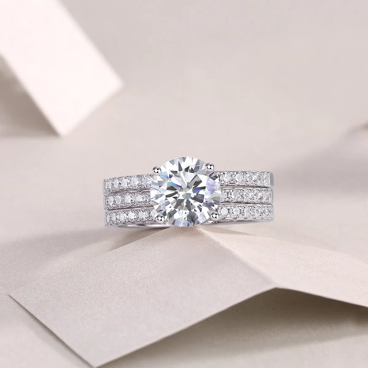Dreamy 2-carat moissanite wedding ring set on white background, S925 silver platinum-plated band