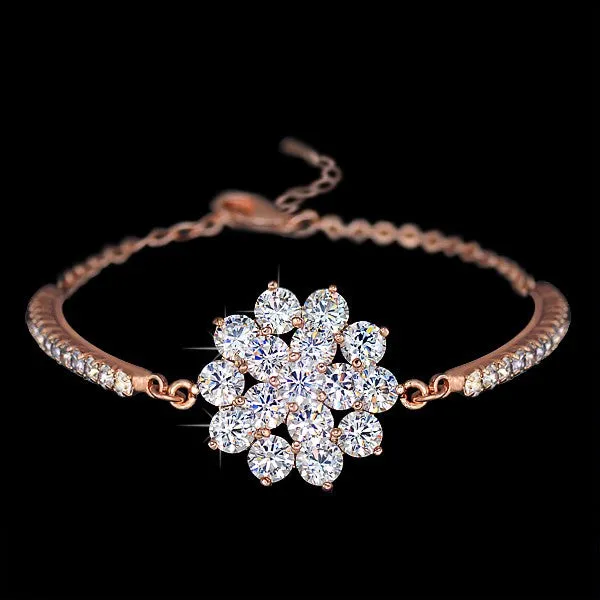 Rose gold cubic zirconia bracelet with cross crown Roman numeral motifs on alloy setting