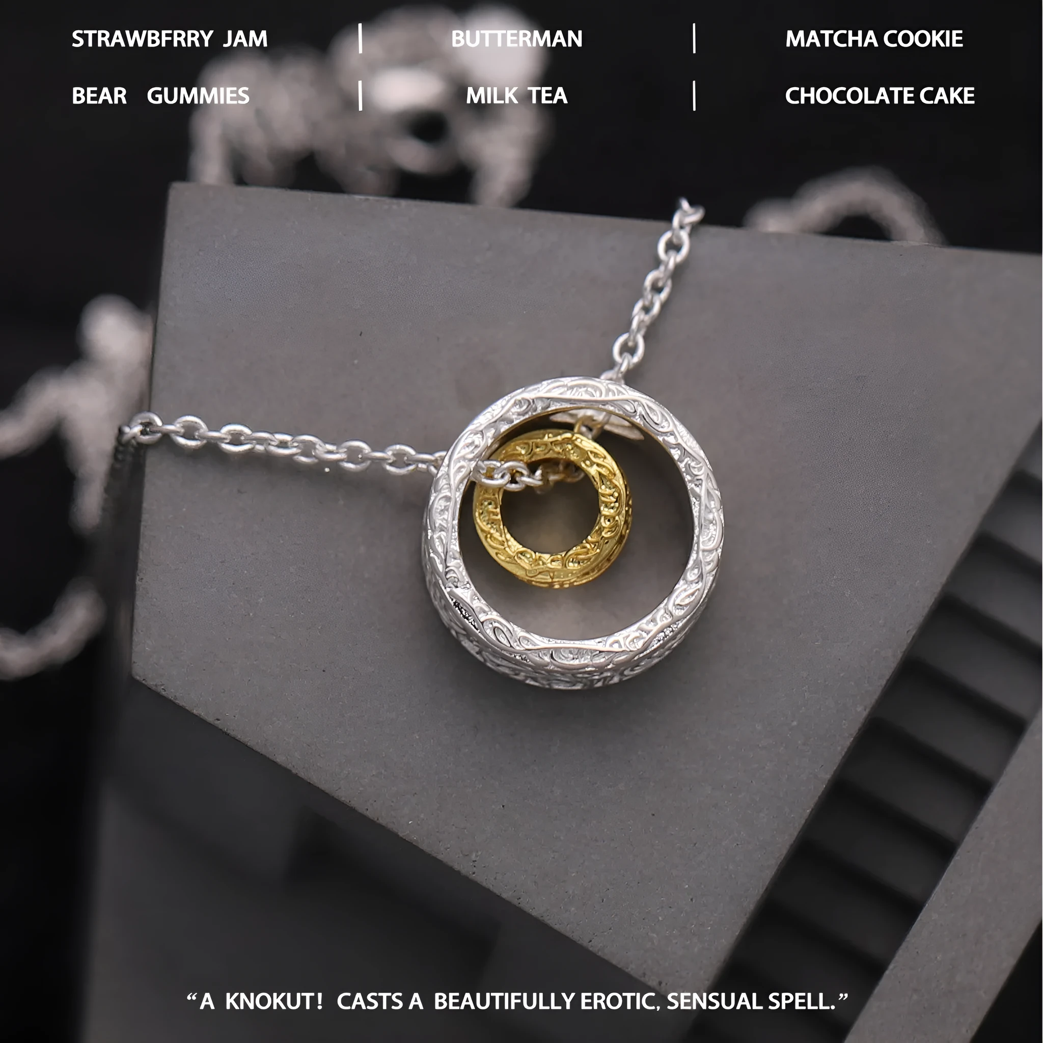Geometric copper nested necklace with gold and silver electroplated finish, round and ring elements, on display