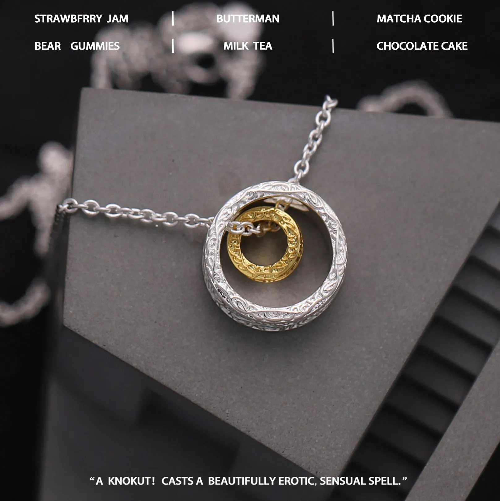 Geometric copper nested necklace with gold and silver electroplated finish, round and ring elements, on display